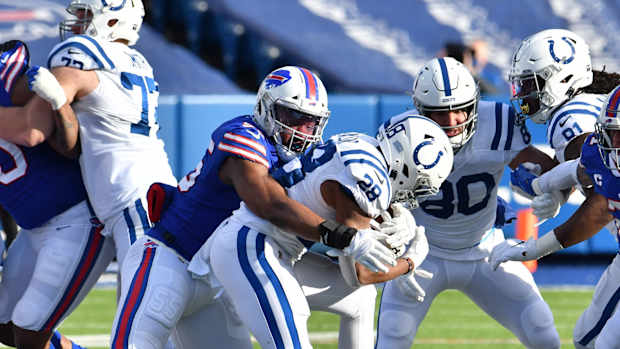 Buffalo Bills defensive end Jerry Hughes wraps up Indianapolis Colts running back Jonathan Taylor in the Bills' 27-24 AFC Wild Card Playoffs victory at Bills Stadium.